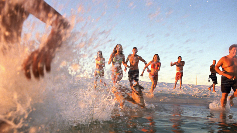 People splash through water