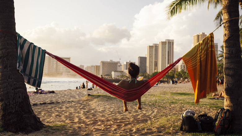 A woman in a beach hammock