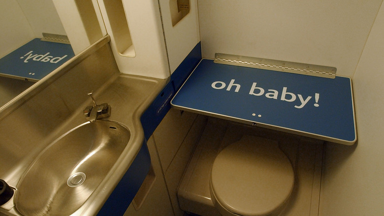 baby changing table in airplane bathroom