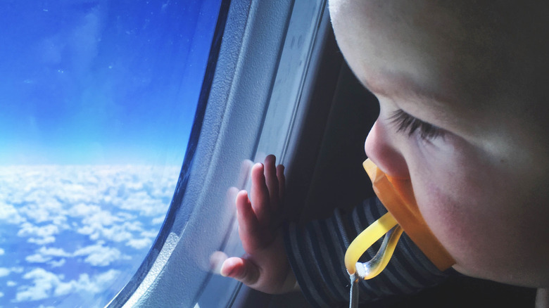 baby face on airplane