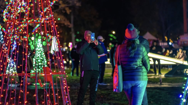 Visitors take photos at the Niagara Falls Winter Festival of Lights