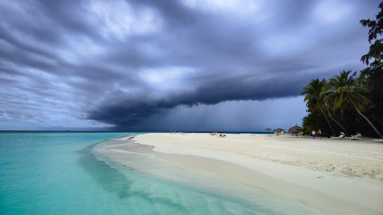 Maldives beach with overcast stormy skies