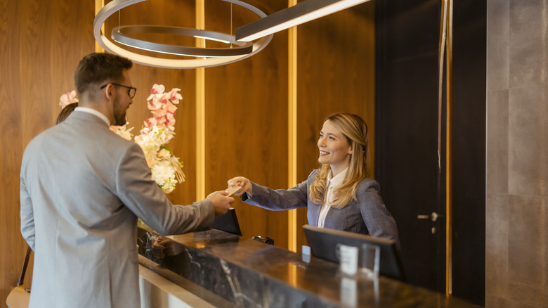 Couple checking into a hotel