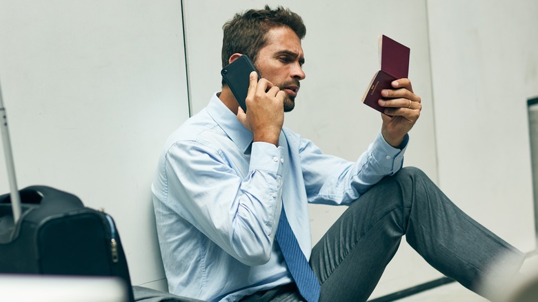 A person looking at their passport