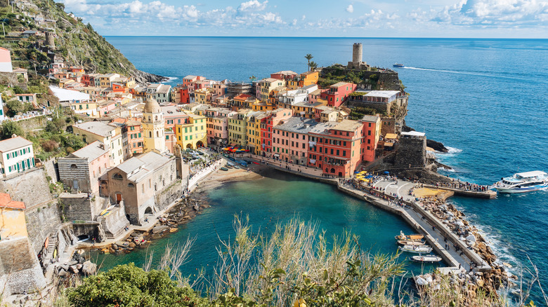 The pastel building in a Cinque Terre Italian village overlooking the sea