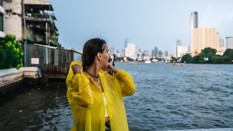 Person in a raincoat in Bangkok, Thailand