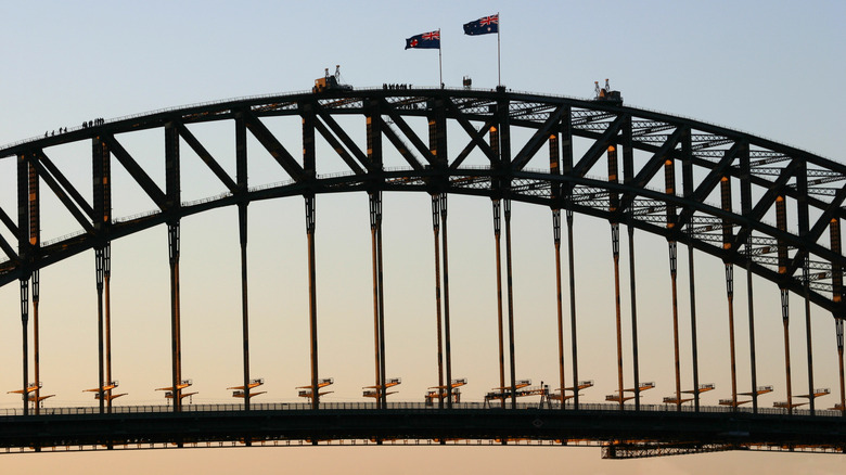 BridgeClimb at the Sydney Harbour Bridge sunset with Australian flags