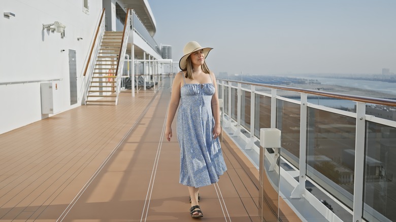 person walking along cruise deck