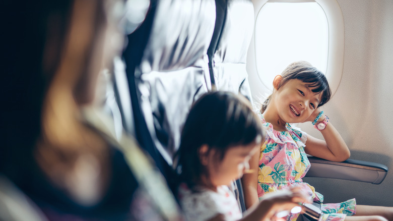 Children flying on an airplane