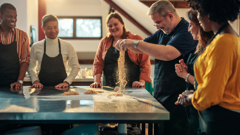 People attending a pasta-making class