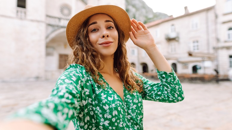 Woman taking a selfie while traveling