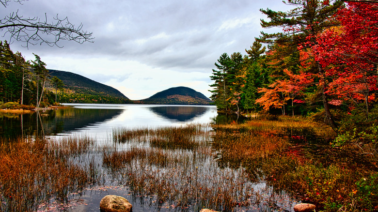 Jordan Pond in Acadia National Park with bright autumn foliage