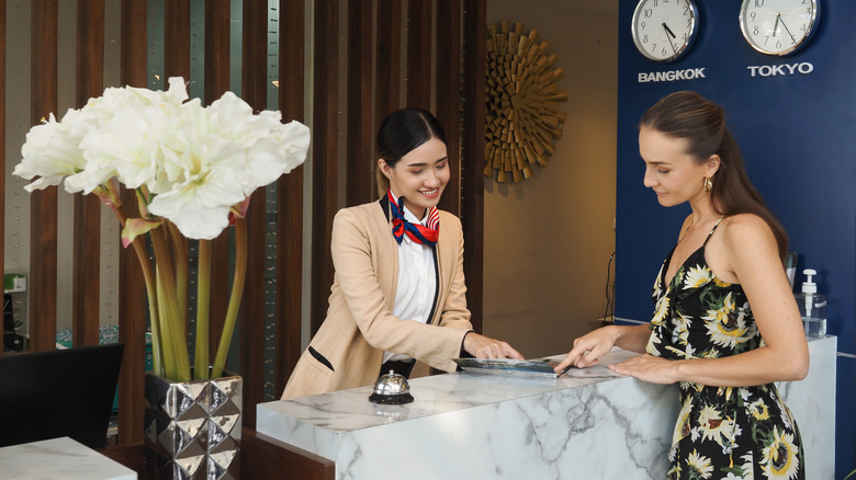 Woman checking into hotel