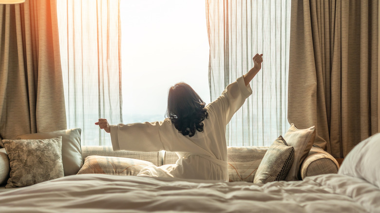 Someone stretching in their hotel room