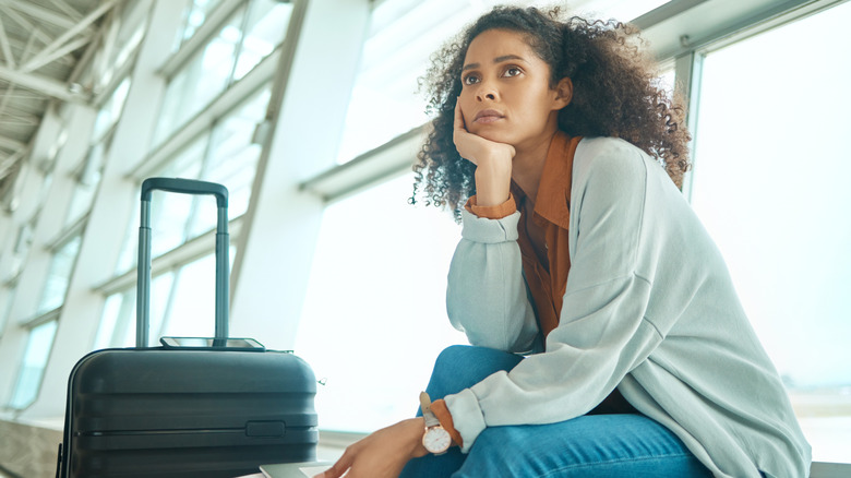 Sad woman at airport