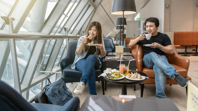 Couple hanging out in an airport lounge