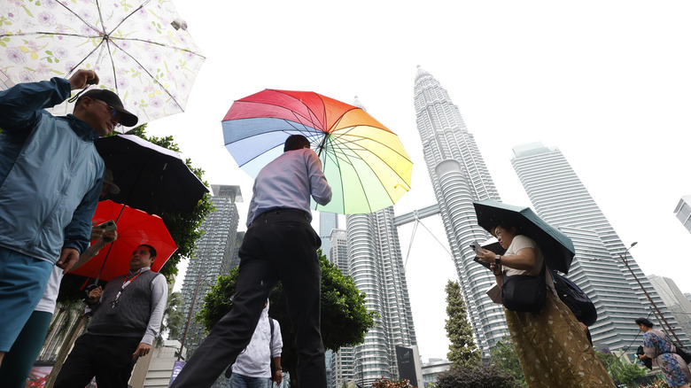 People in Kuala Lumpur on rainy day