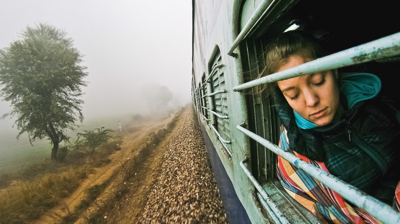 Traveler riding on train in India