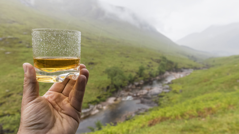 Raising a dram in the Scottish Highlands.