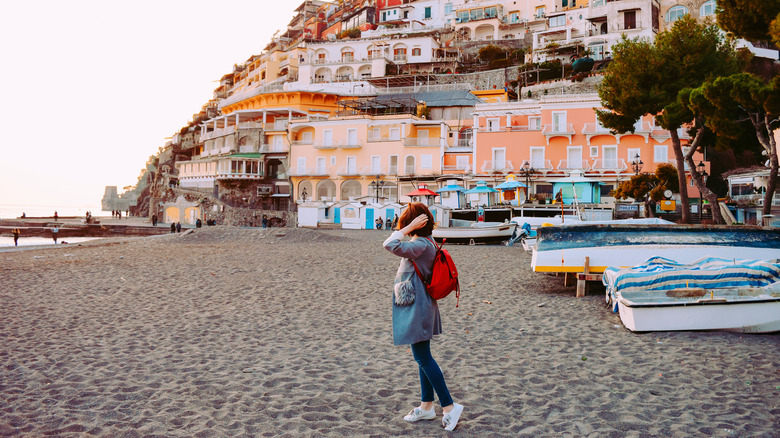 Girl in a coat on the Amalfi coast in off season