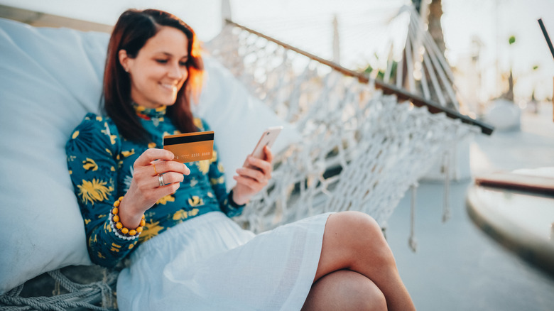 A woman booking a vacation using her credit card