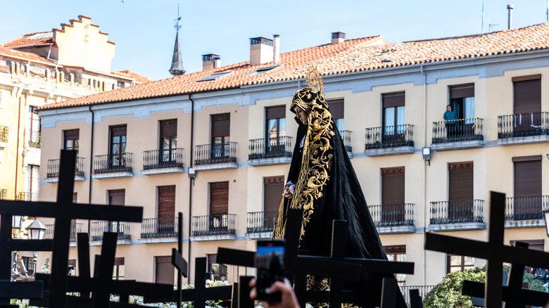 Holy Week procession in front of residential buildings in Zamora, Spain