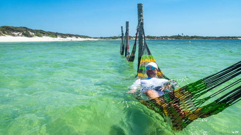 man in an ocean hammock