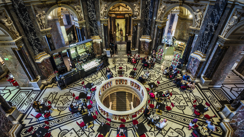 A top down view of the Art Deco style of Cafe Central in Vienna with a circular banister