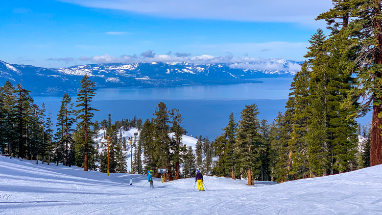 Skiers at Heavenly Mountain with Lake Tahoe in the background