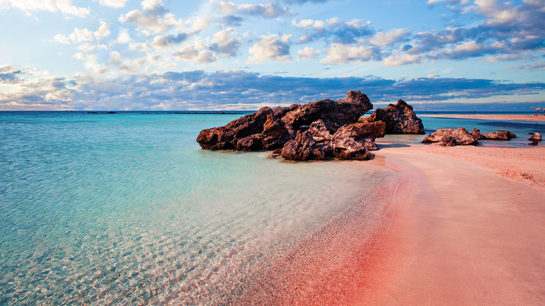 A picturesque pink beach on the coast of Greece