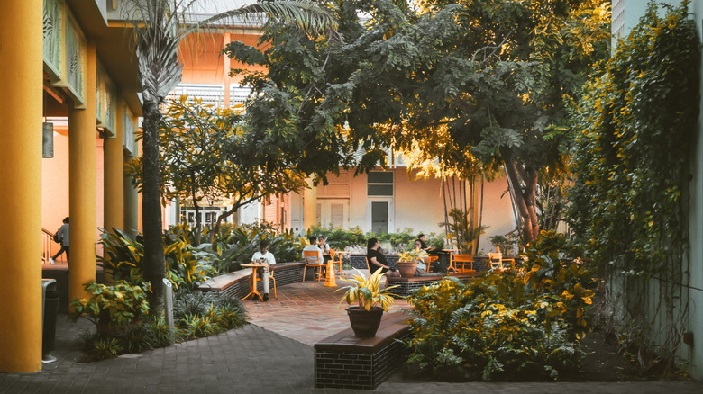 People sitting in a courtyard in Camana Bay, Cayman Islands