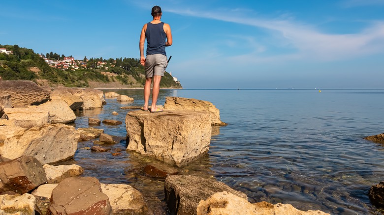 Man looking out over the Gulf of Piran