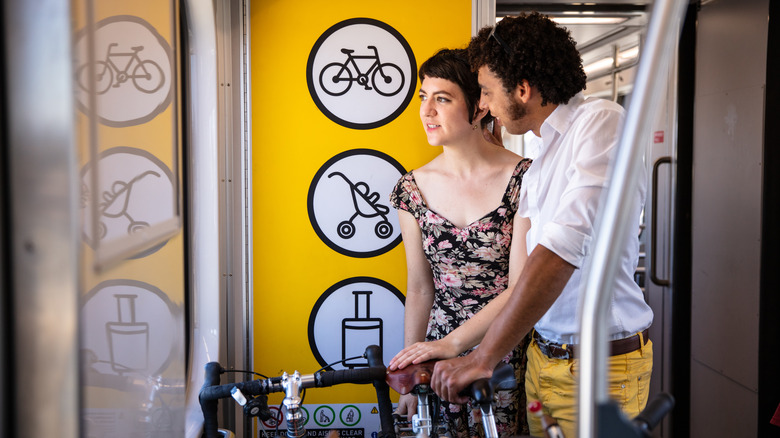 Man and woman with bikes on LA metro