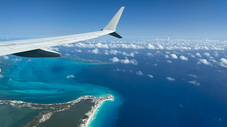 Plane flying over Cancún, Mexico