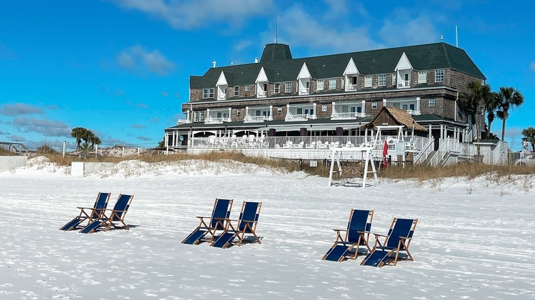 Chairs in the white sand beach in front of Henderson Beach Resort in Destin, Florida