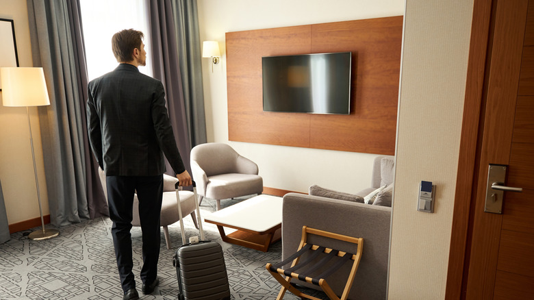 Traveler looks at hotel TV