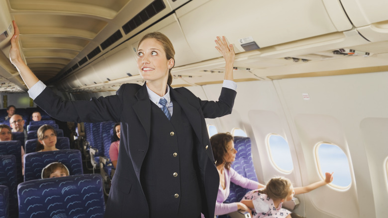 Flight attendant in cabin