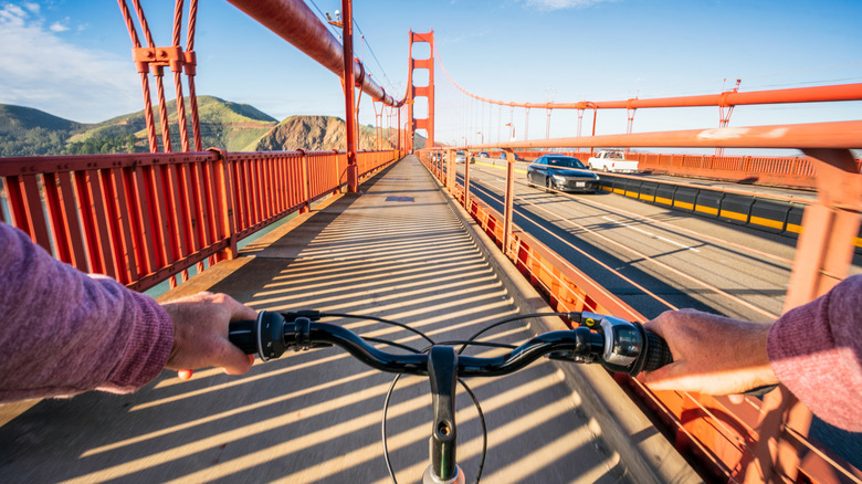 Cyclist riding down the Golden Gate Bridge in San Francisco