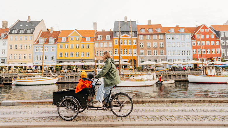 Mother and child cycling in Copenhagen, Denmark