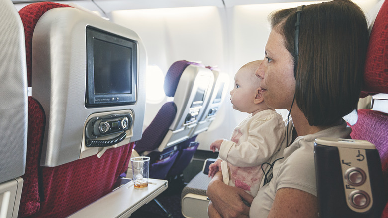 A baby and a mother in flight