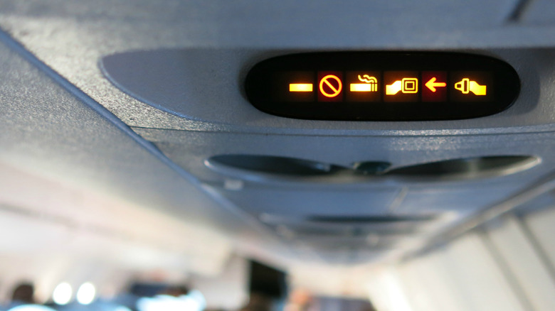 illuminated no smoking sign on an airplane