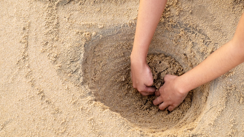 Child digging hole 