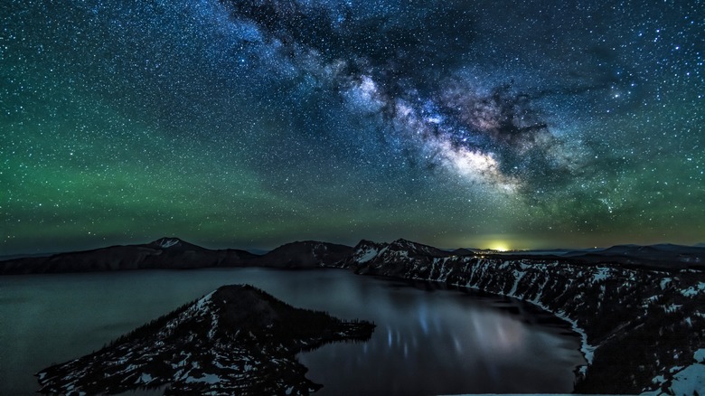 Crater Lake at night with the Milky Way visible above it