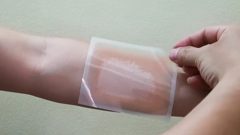 tattoo seal tape hides tattoo on arm