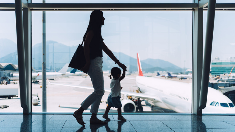 Woman with toddler at airport