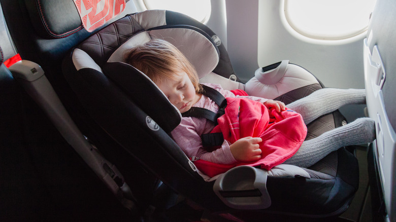 Girl sleeping on plane