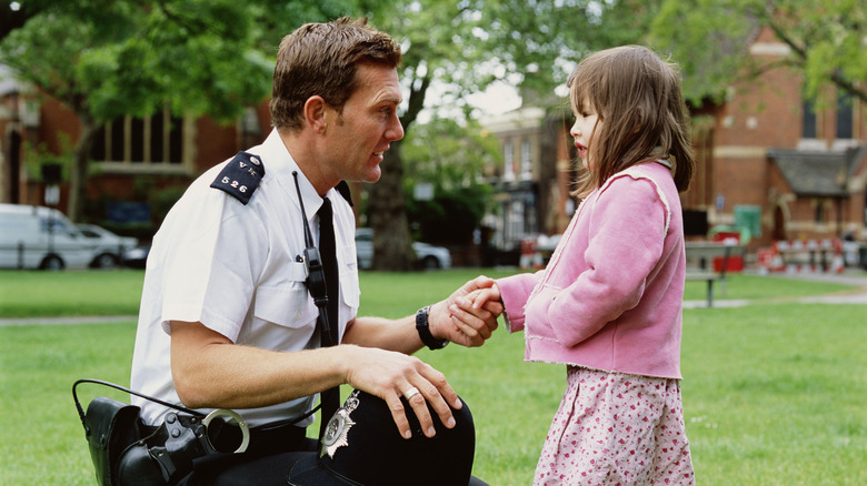 Girl talking to police officer