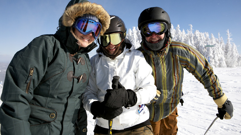 Skiers smiling on the slopes of Killington, Vermont