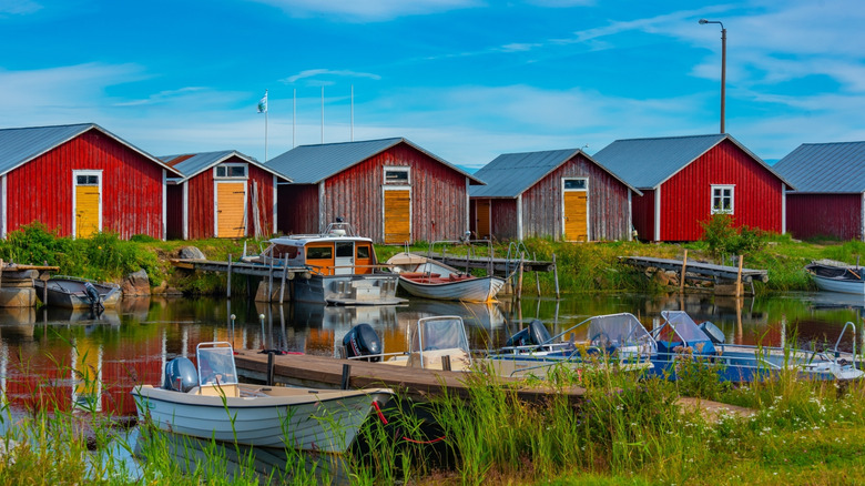 Red timber boat houses in Svedjehamn, Finland