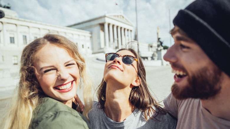 Young people laughing outdoors in Europe